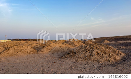 Mounds of dirt and sand at an open desert construction site Mounds of dirt and sand at an open desert construction site 142816092