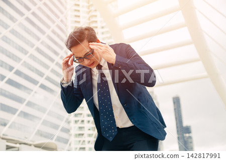 Businessman Headache Head Pain Migraine Stress. Man Stressed Heat Stroke Heatwave. City Hot Weather Businessman Headache Head Pain Migraine Stress. Man Stressed Heat Stroke Heatwave. City Hot Weather 142817991