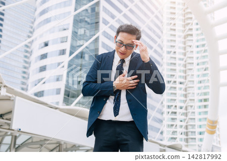Businessman Suffering Chest Pain Heart Attack Stress Work Overload Office Outdoors Emergency Businessman Suffering Chest Pain Heart Attack Stress Work Overload Office Outdoors Emergency 142817992