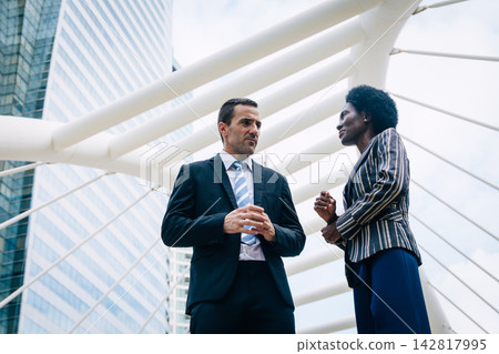 Businessman with African Black Woman Talking Discussion Serious Conversation Corporate Diversity Businessman with African Black Woman Talking Discussion Serious Conversation Corporate Diversity 142817995