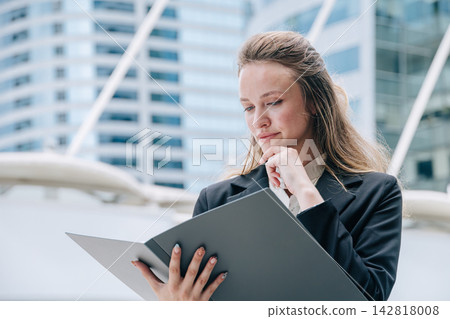 Professional Business woman Reading Document Folder Thinking Serious Expression Problem Solving 142818008