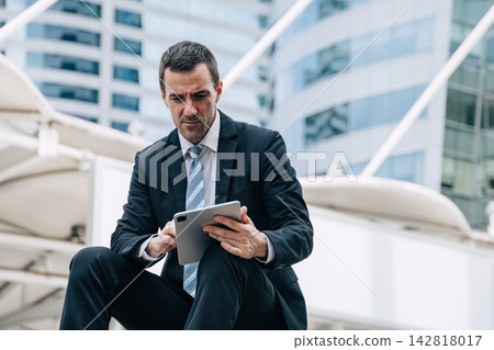 Latino Businessman Reading Bad News Digital Tablet Stressed Worried Financial Crisis Latino Businessman Reading Bad News Digital Tablet Stressed Worried Financial Crisis 142818017