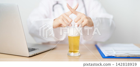 Doctor hand stop to refuse Beer, quitting drink for healthy liver, prevent Alcoholic cirrhosis and cancer, World No Alcohol Day, medical advice for sobriety and Alcoholism and addiction concept Doctor hand stop to refuse Beer, quitting drink for healthy liver, prevent Alcoholic cirrhosis and cancer, World No Alcohol Day, medical advice for sobriety and Alcoholism and addiction concept 142818919
