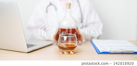 Doctor hand stop to refuse Whisky, quitting drink for healthy liver, prevent Alcoholic cirrhosis and cancer, World No Alcohol Day, medical advice for sobriety and Alcoholism and addiction concept 142818920