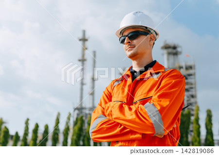 Refinery Engineer Standing Arms Crossed Confident Outdoor Industrial Plant Facility. Refinery Engineer Standing Arms Crossed Confident Outdoor Industrial Plant Facility. 142819086