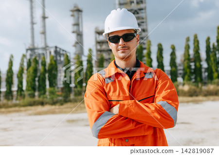 Refinery Engineer Standing Arms Crossed Confident Outdoor Industrial Plant Facility. Refinery Engineer Standing Arms Crossed Confident Outdoor Industrial Plant Facility. 142819087