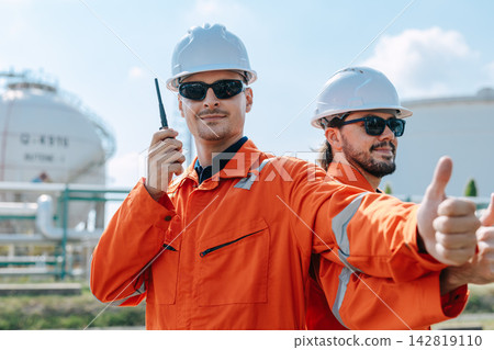 Refinery Engineer Talking Walkie Talkie Thumbs Up Outdoor Industrial Plant Facility. 142819110