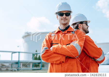 Portrait Refinery Engineer Standing Arms Crossed Confident Success Team Outdoor Industrial Plant. Portrait Refinery Engineer Standing Arms Crossed Confident Success Team Outdoor Industrial Plant. 142819111