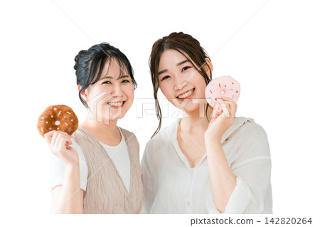 Women eating donuts, sweets, snacks, desserts Women eating donuts, sweets, snacks, desserts 142820264