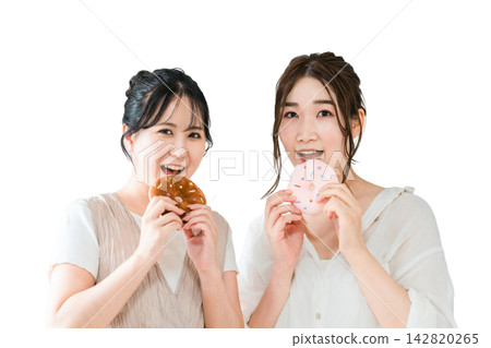 Women eating donuts, sweets, snacks, desserts Women eating donuts, sweets, snacks, desserts 142820265