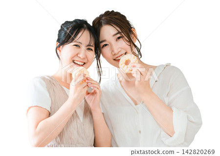 Women eating donuts, sweets, snacks, desserts 142820269