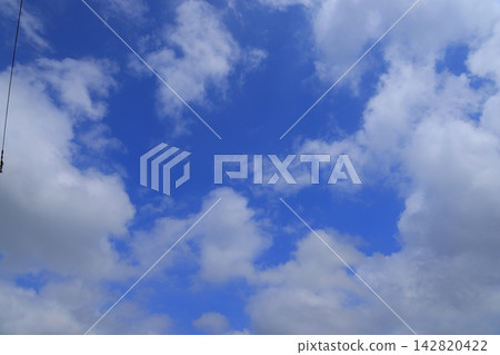 Blue sky with sun and clouds Blue sky with sun and clouds 142820422