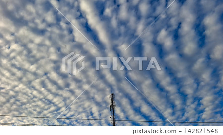 Telecommunication tower under dramatic cloudscape sky Telecommunication tower under dramatic cloudscape sky 142821548