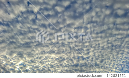 Panoramic view of dappled altocumulus cloud sky Panoramic view of dappled altocumulus cloud sky 142821551