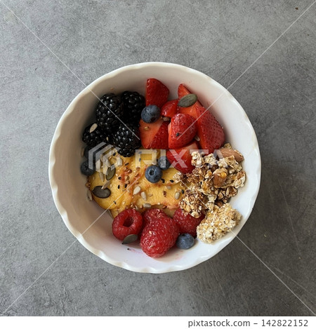 Creamy yogurt bowl topped with fresh fruits and crunchy toppings, offering a smooth texture and refreshing taste. Light, wholesome, and visually appealing, perfect for breakfast or healthy snack. Creamy yogurt bowl topped with fresh fruits and crunchy toppings, offering a smooth texture and refreshing taste. Light, wholesome, and visually appealing, perfect for breakfast or healthy snack. 142822152