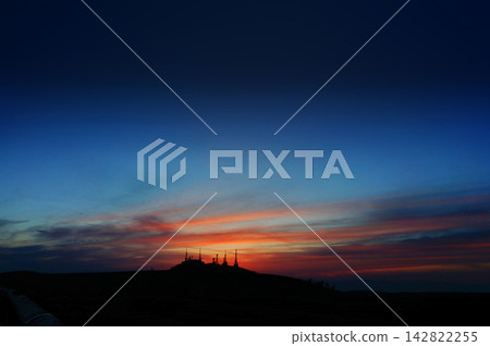 The beautiful sunset over Utsukushigahara and the silhouette of the radio tower. The beautiful sunset over Utsukushigahara and the silhouette of the radio tower. 142822255