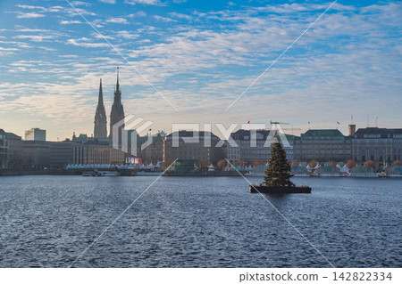 Hamburg Germany city skyline at Alster Lake with Christmas tree Hamburg Germany city skyline at Alster Lake with Christmas tree 142822334