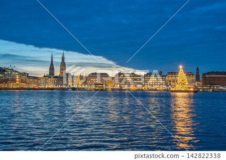Hamburg Germany night city skyline at Alster Lake with Christmas tree Hamburg Germany night city skyline at Alster Lake with Christmas tree 142822338