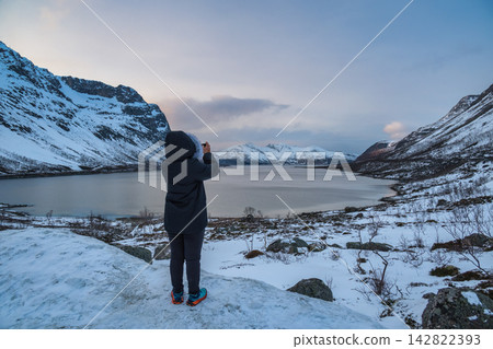 Tromso Norway, woman tourist taking photo of winter nature landscape at Grotfjord 142822393