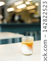 Glass of milk latte coffee on a table. 142822523