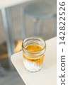 Glass of milk latte coffee on a table. 142822526