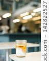 Glass of milk latte coffee on a table. 142822527