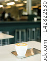 Cup of hot milk coffee with latte art. 142822530