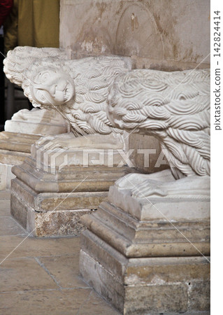 Batalha, Portugal - April 02, 2017 - Batalha Monastery showcases intricate lion sculptures Batalha, Portugal - April 02, 2017 - Batalha Monastery showcases intricate lion sculptures 142824414