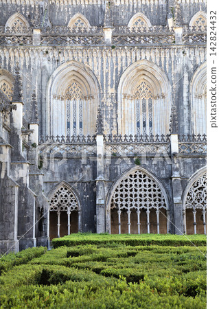Gothic architecture and manicured gardens at Batalha Monastery in Portugal Gothic architecture and manicured gardens at Batalha Monastery in Portugal 142824432