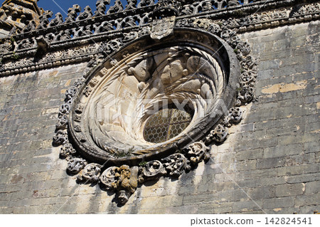 Details of intricate stonework of a window at Convento de Cristo in Tomar, Portugal Details of intricate stonework of a window at Convento de Cristo in Tomar, Portugal 142824541