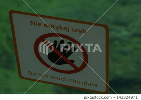 Warning Sign Against Touching Glass in Public Setting Warning Sign Against Touching Glass in Public Setting 142824971