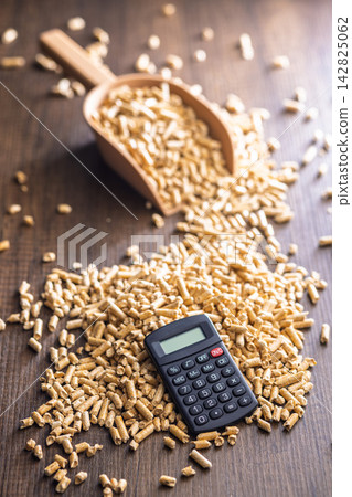 Wood Pellet Fuel Scoop With Calculator for Energy Cost Calculation and Biomass Heating Budgeting Wood Pellet Fuel Scoop With Calculator for Energy Cost Calculation and Biomass Heating Budgeting 142825062