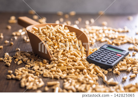 Wood Pellet Fuel Scoop With Calculator for Energy Cost Calculation and Biomass Heating Budgeting Wood Pellet Fuel Scoop With Calculator for Energy Cost Calculation and Biomass Heating Budgeting 142825065