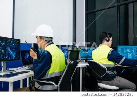 Asian male engineer in a hard hat Asian male engineer in a hard hat 142825283