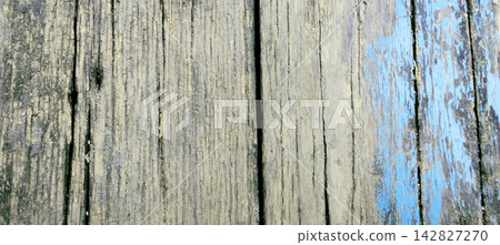 Weathered wooden plank texture with peeling blue paint Weathered wooden plank texture with peeling blue paint 142827270