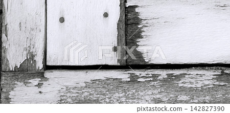 Monochrome wooden planks with a distressed look and peeling paint. Monochrome wooden planks with a distressed look and peeling paint. 142827390