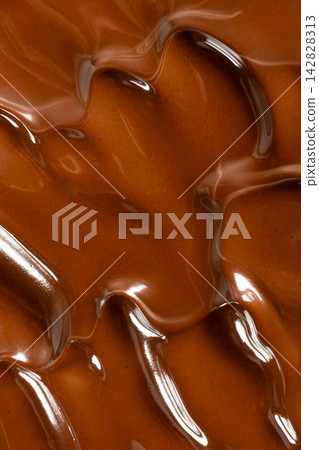 Glossy melted chocolate waves abstract background vertical macro shot Glossy melted chocolate waves abstract background vertical macro shot 142828313