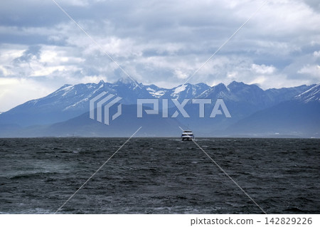Ferry Crossing Beagle Channel with Snowy Andes Mountains Ushuaia Ferry Crossing Beagle Channel with Snowy Andes Mountains Ushuaia 142829226