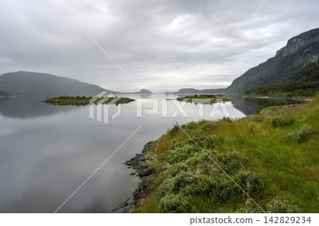 Calm Fjord Landscape with Islands at Tierra del Fuego Calm Fjord Landscape with Islands at Tierra del Fuego 142829234