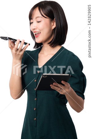 Happy southeast asian woman using smartphone voice command and tablet for artificial intelligence chatbot interaction during work isolated on transparency background Happy southeast asian woman using smartphone voice command and tablet for artificial intelligence chatbot interaction during work isolated on transparency background 142829905