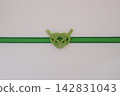 Light green Awaji knot mizuhiki decoration, white background, with space for copying. 142831043