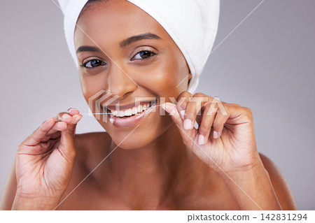 Floss, portrait and woman in studio for dental care, gum health and fresh breath with pride. female model, plaque remove and product for wellness, oral hygiene and teeth whitening by gray background Floss, portrait and woman in studio for dental care, gum health and fresh breath with pride. female model, plaque remove and product for wellness, oral hygiene and teeth whitening by gray background 142831294