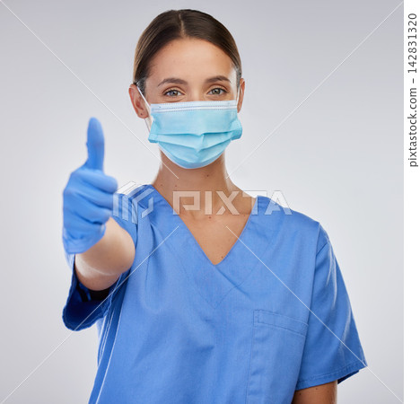 Mask, nurse and woman with thumbs up, portrait and studio for safety, yes and thank you for healthcare. White background, medical and person in mockup, professional and healthy in clinic and expert 142831320