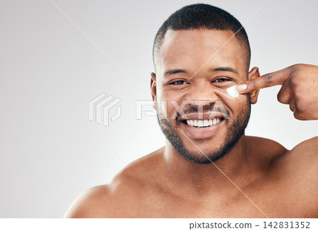 Black man, face cream and portrait in studio for skincare with application, cosmetics and pride by mockup. Male model, hand or beauty treatment with lotion, moisturizer or results by white background 142831352