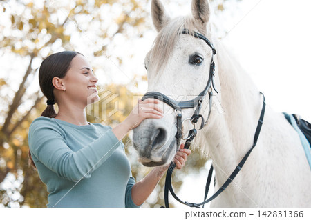 Smile, horse and happy woman on farm for care, love and passion for recreation. Holding harness, person and animal at ranch for hobby, pet and livestock or stallion for discipline or equestrian Smile, horse and happy woman on farm for care, love and passion for recreation. Holding harness, person and animal at ranch for hobby, pet and livestock or stallion for discipline or equestrian 142831366