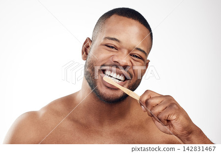 Black man, portrait and brushing teeth or toothbrush cleaning for healthy gums, hygiene or white background. Male person, face and whitening routine in studio for self care or mockup, plaque or oral Black man, portrait and brushing teeth or toothbrush cleaning for healthy gums, hygiene or white background. Male person, face and whitening routine in studio for self care or mockup, plaque or oral 142831467
