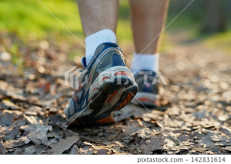 Hike, man or athlete walking in forest for exercise, trekking or summer adventure for health and fitness. Male person, outdoor and sports shoes on for performance, morning cardio and exploring nature Hike, man or athlete walking in forest for exercise, trekking or summer adventure for health and fitness. Male person, outdoor and sports shoes on for performance, morning cardio and exploring nature 142831614