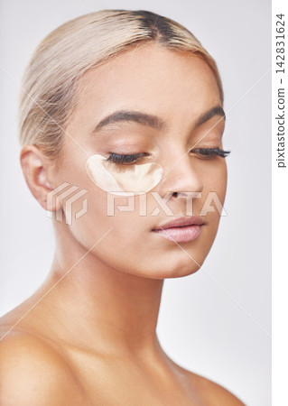 Eye pad, skincare and woman in studio with collagen, natural and beauty facial treatment. Cosmetic, health and female person with gel dermatology product for face routine isolated by white background Eye pad, skincare and woman in studio with collagen, natural and beauty facial treatment. Cosmetic, health and female person with gel dermatology product for face routine isolated by white background 142831624