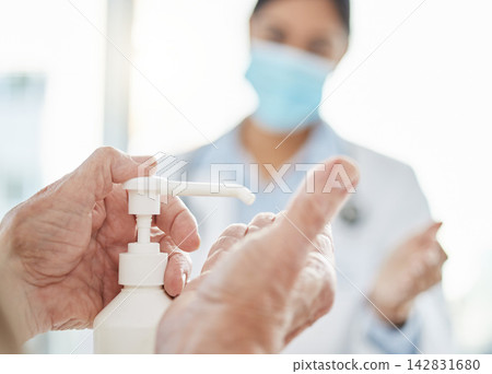 Hands, hospital and cleaning for germs or healthcare, hygiene and safety protocol for diseases or viruses. Senior person, female doctor and sanitiser for disinfection, sterilization and risk. Hands, hospital and cleaning for germs or healthcare, hygiene and safety protocol for diseases or viruses. Senior person, female doctor and sanitiser for disinfection, sterilization and risk. 142831680