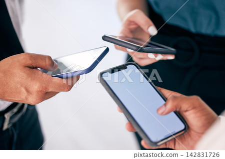 Business people, hands and smartphone in circle for mockup, unity and collaboration in office. Corporate team, mobile and scrum for digital synergy, contact and company communication for networking Business people, hands and smartphone in circle for mockup, unity and collaboration in office. Corporate team, mobile and scrum for digital synergy, contact and company communication for networking 142831726
